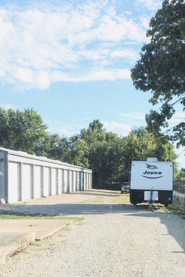 A trailer parked in outside storage